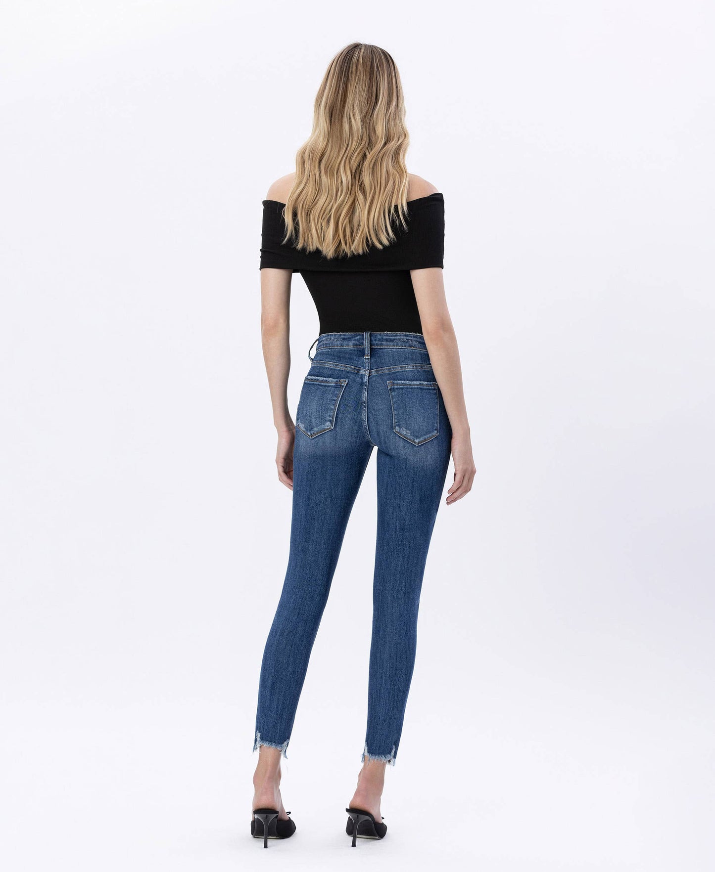 HIGH RISE DISTRESSED HEM SKINNY JEANS